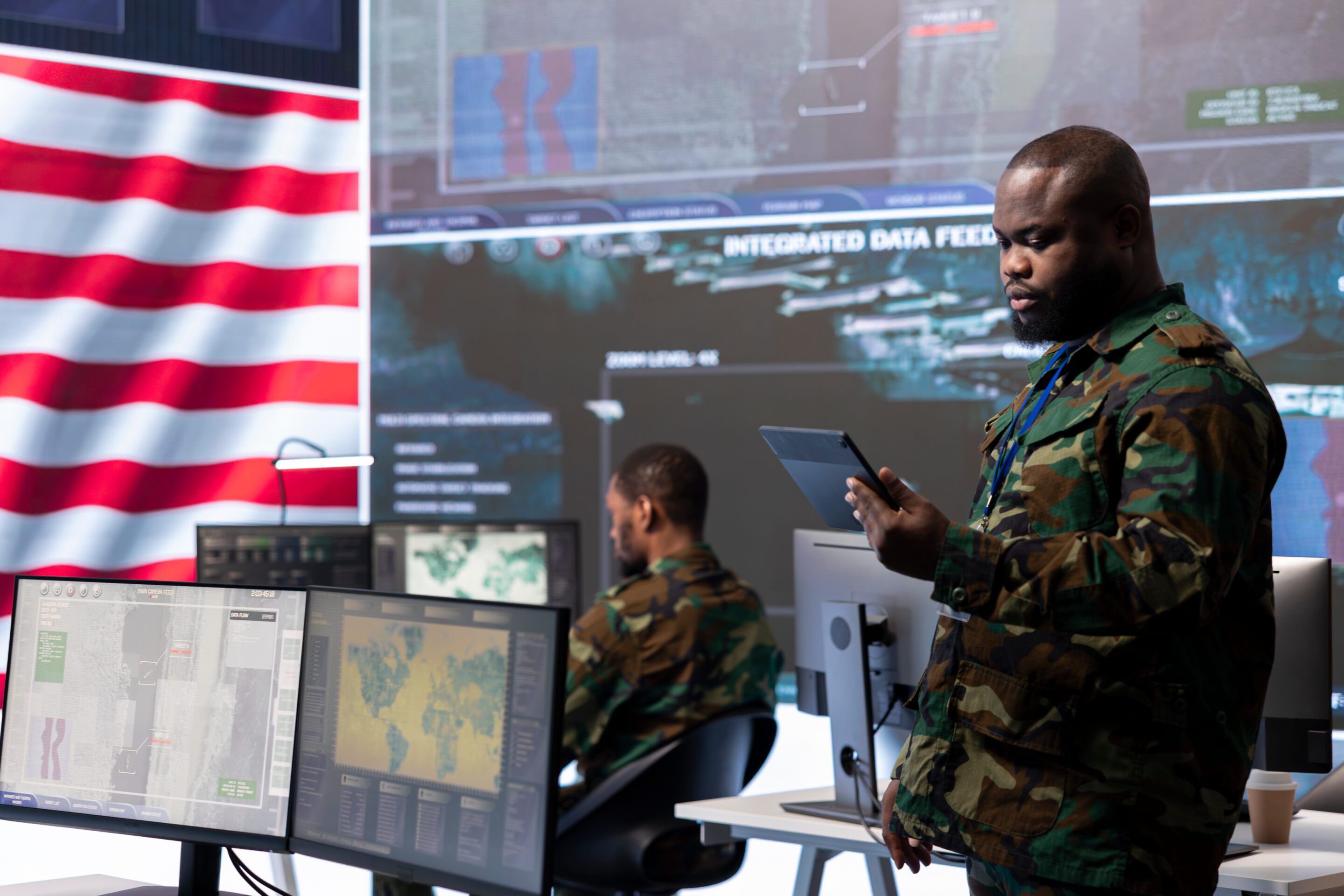 US military personnel work in a modern army command post