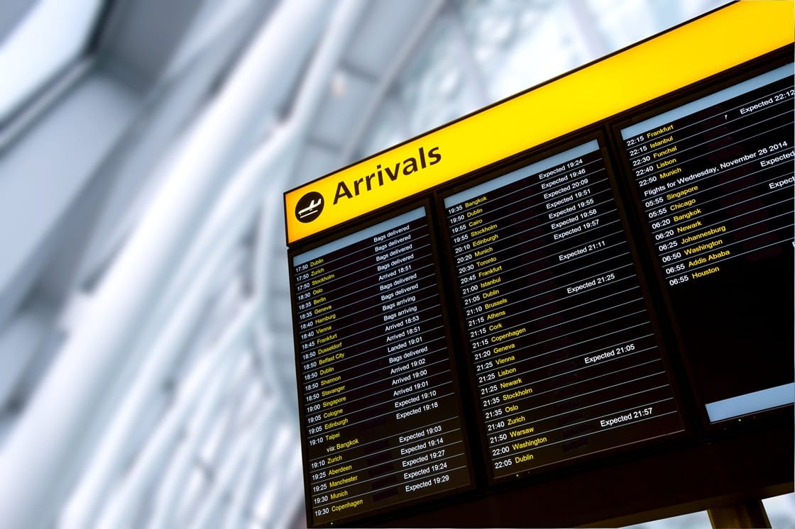 Bright digital signage displays illuminating an urban commercial environment at night
