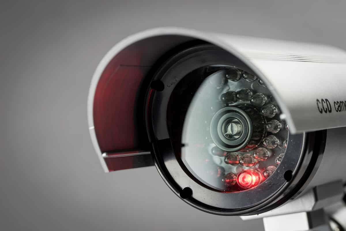 Security operations center with multiple surveillance monitors displaying live camera feeds for 24-7 public safety